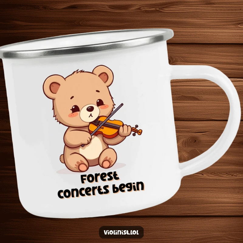 Funny camping mug of a small bear cub sawing its violin with great enthusiasm and wide, delighted eyes outdoors.