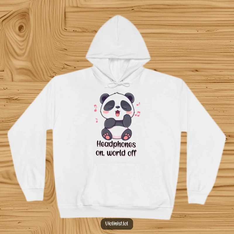 Funny panda with eyes squeezed shut in melodic bliss, enjoying a song, on a cozy hoodie, perfect funny gift.
